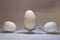 Equilibrium of three white eggs on two forks