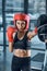 equiped sporty female boxer training