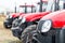 Equipment for agriculture, machines presented to an agricultural exhibition. Tractors outdoors