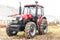 Equipment for agriculture, machines presented to an agricultural exhibition. Tractors outdoors