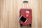 Equipment for company employees preparing to travel or work abroad,tablet and passport Placed on a red suitcase summertime concept