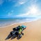 Equipment for Diving on the sea beach with blue sky and sun