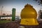 Equipment part of an industrial system in form of a tank in yellow and green colours. yellow pressure tank for storage of material