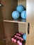 Equipment of the room of therapeutic physical training. In the open case lie dumbbells and balls.