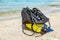 Equipment of a scuba diver, an oxygen balloon lies on the beach. Diving, equipment, fins, balloons, masks