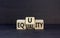 Equity or equality symbol. Concept word Equity Equality on wooden cubes. Beautiful black table black background. Business and