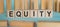 EQUITY. Word written on wooden blocks on light blue background