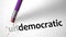 Eraser changing the word Undemocratic for Democratic
