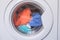 Erasing home t-shirts. Dirty clothes are inside the washing machine. Automatic washer with open door