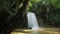 Erawan waterfall in the rainy season with turbid water with green forest