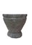 Erect black-gray granite mortar with white background Used to break down food to make it resolution. Use a pound with a pestle mad