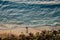 Ericeira PORTUGAL - 18 October 2020 - Sunset with aerial view of silhouette of surfer with board coming out of the Atlantic Ocean