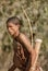 Erindi, Namibia / July 19, 2018: A native bushman gives a farewell dance to wish good hunting to the photographers