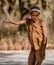 Erindi, Namibia / July 19, 2018: A native bushman gives a farewell dance to wish good hunting to the photographers
