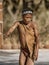 Erindi, Namibia - July 19, 2018: A native bushman gives a farewell dance to wish good hunting to the photographers