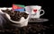 Eritrean flag in a bag with coffee beans isolated on black