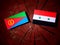 Eritrean flag with Syrian flag on a tree stump