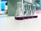 The Erlenmeyer or Conical flask on bench laboratory, with purple solvent forming reaction between boric acid and ammonia solution.