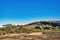 Eroded granite rocks, boulders and stunted outback vegetation, Western Australia