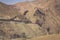 Eroded land under blue sky and white clouds, Atlas mountains, Mo