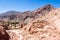 Eroded mountains in the Argentine Andes and green vegetation