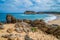 Eroded rocks on ocean coastline.