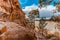 Eroding orange sandstone cliffs.