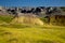 Eroding peaks and prairie grass of the Badlands National Park So