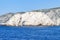 Erosion by the deep blue sea formed a large hole in the rocks along the coast of the island of Zakynthos, Greece