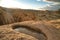 Erosion on rocks with puddle of water on hole at Joshua Tree National Park