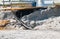 Erosion of the sand of the beach wih destruction of a asphalt path after a hurricane and storm.