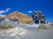 Erosion weathering blue rock formations Plano de El Mojon against the background of a volcanic cone, blue sky