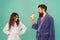 Erotic games for couple. Couple in love blue background. Sensual couple. Sexy woman look at bearded man eating banana