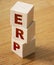 ERP abbreviation made of wooden cubes on wooden table. Business concept