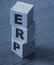 ERP abbreviation made of wooden cubes on wooden table. Business concept