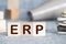 ERP Enterprise Resource Planning written on a wooden cube in a office desk