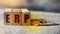 ERP letters on wooden blocks and coins. Enterprise Resource Planning business finance concept