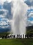 Erupting geyser and tourists, Iceland