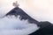 Eruption of volcano Fuego in cloudy and misty weather