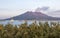 Eruption of the Vulcan Sakurajima and Kagoshima Ferry arriving the Port during summer sunset. Located in Kagoshima, Kyushu, South