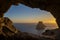 Es Vedra islet view through a rock hole at sunset