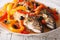 Escabeche fish: mackerel in vegetable marinade close-up. horizon