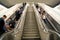 Escalator metro underground subway with commuters