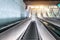 Escalators long staircase descending into the subway, urban transport infrastructure