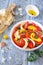 Escalivada. Vegetable salad: roasted bell pepper with onions, tomatoes and olive oil