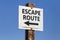 Escape route word and arrow signpost