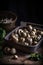 Escargot snails in container on the table in rustic kitchen