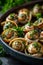 Escargots stuffed with butter and herbs. Selective focus.