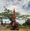 an escavator is parked in front of the pioneering independence street shop