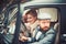 Escort of girl by security. escort concept with bearded driver and luxury girl in retro car.